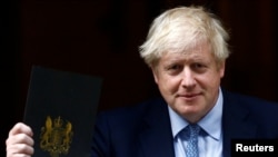 Britain's Prime Minister Boris Johnson leaves Downing Street in London, Britain, Sept. 25, 2019. 