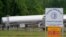 Tanker trucks are parked near the entrance of Colonial Pipeline Company May 12, 2021, in Charlotte, N.C. The operator of the nation’s largest fuel pipeline has confirmed it paid $4.4 million to a gang of hackers.