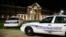 Huffman High School is seen behind Birmingham Police cars after a fatal shooting, March 7, 2018, in Birmingham, Alabama.