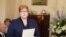 Australia's first female Minister for Defense Marise Payne is sworn in by Governor-General Peter Cosgrove during the swearing-in ceremony of Prime Minister Malcolm Turnbull's cabinet at Government House Monday, Sept. 21, 2015.