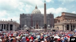 FILE - Pilgrims crowd St. Peter's Square at the Vatican, May 30, 1998, on Pentecost Day. 