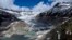 FILE - A lake of meltwater has formed on the tongue of the Rhone Glacier near Goms, Switzerland, June 13, 2023.