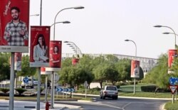 FILE - A general view with posters of university of Texas A&amp;M is seen at Education City in Doha, Qatar, Oct. 18, 2011.