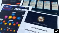 FILE: Pages from the U.S. State Department's Global Engagement Center report released on Aug. 5, 2020.The department detailed a Russian-backed misinformation that spreads false information online by infiltrating U.S. social media. Many disinformation actors exist besides Russia.