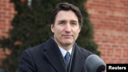 Justin Trudeau u momentu objave odluke o povlačenju sa funkcije stranačkog lidera i kanadskog premijera. (Foto: REUTERS/Patrick Doyle)