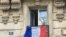 A banner outside Paris thanking health care workers and others on the frontlines of the coronavirus battle. (Lisa Bryant/VOA)