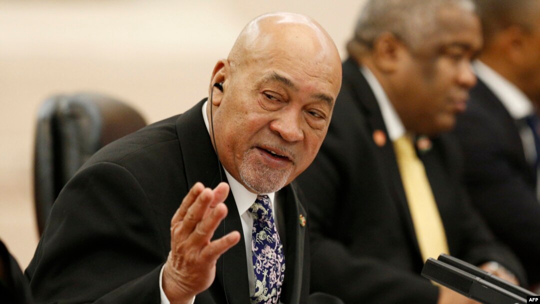 FILE - Suriname's President Desi Bouterse attends a meeting at the Great Hall of the People in Beijing on Nov. 27, 2019.