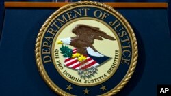 FILE - The Department of Justice seal is seen in Washington, Nov. 28, 2018. 