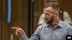 Nathan Smith gestures as he makes a victim impact statement during the sentencing hearing for Australian Brenton Harrison Tarrant at the Christchurch High Court, in Christchurch, New Zealand, Aug. 25, 2020.