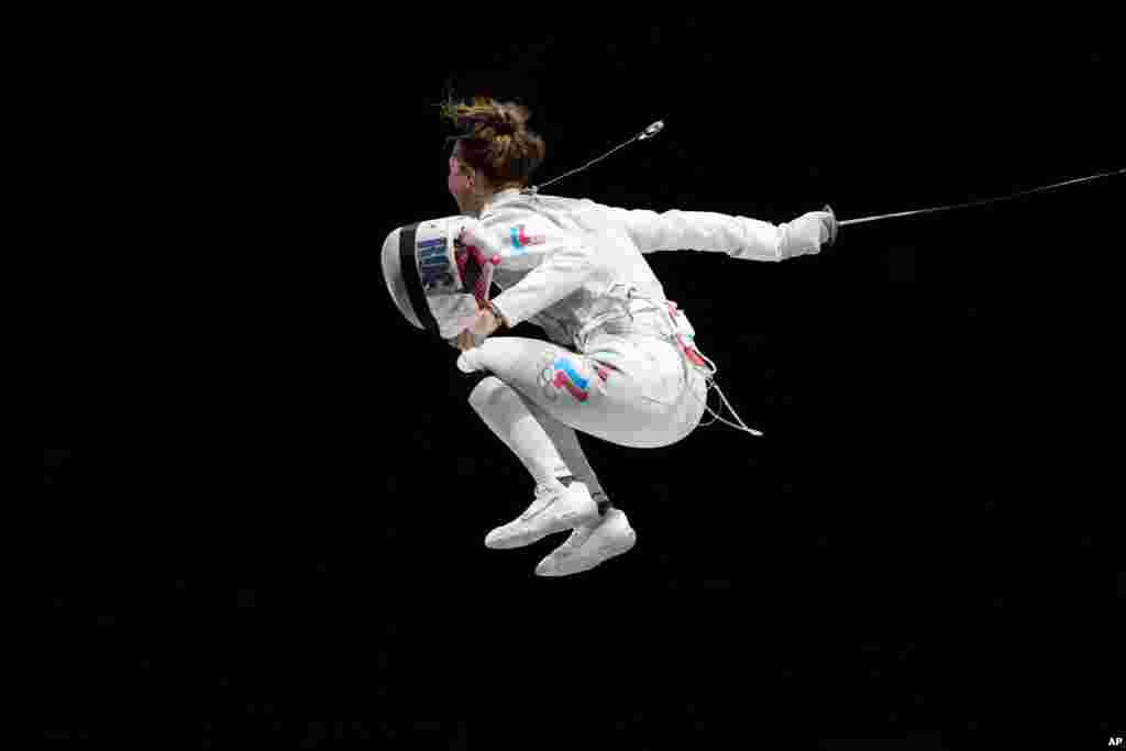 Larisa Korobeynikova of the Russian Olympic Committee celebrates winning the women&#39;s individual Foil bronze medal final competition at the 2020 Summer Olympics, July 25, 2021, in Chiba, Japan.