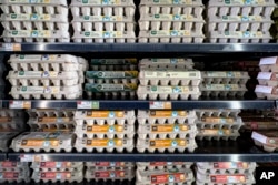 Various grades of eggs are displayed for sale at a Whole Foods grocery store, Friday, Jan. 19, 2024, in New York. (AP Photo/Peter K. Afriyie)