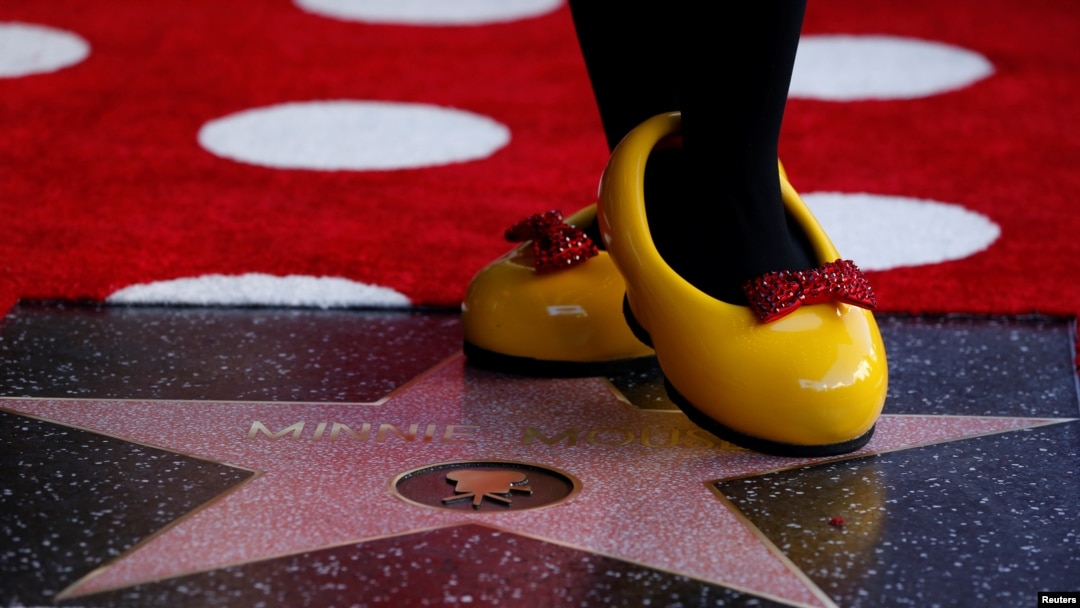 The character of Minnie Mouse poses on her star after it was unveiled on the Hollywood Walk of Fame in Los Angeles, California, Jan. 22, 2018.