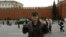 A man identified as Tajik Alan Chekranov holding a pistol and extending one finger -- a common sign used by Islamist militants to mean "one," an attestation of belief in tawhid, or monotheism -- at Red Square in Moscow, possibly in 2012.