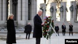 U.S. President Joe Biden and First Lady Jill Biden visit the World War Two Memorial Site on the 80th anniversary of the attacks on Pearl Harbor, Hawaii, at the National Mall in Washington on December 7, 2021. (Tom Brenner/Reuters)