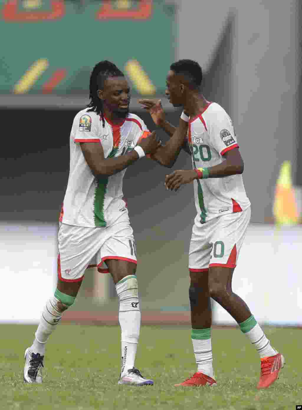 Burkina Faso&#39;s captain Bertrand Traore, left, celebrates after scoring his team&#39;s first goal against Gabon in Cameroon on Jan. 23, 2022.