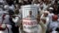 Seorang pengunjuk rasa mengacungkan poster dalam demonstrasi menuntut agar Gubernur Basuki Tjahaya Purnama atau Ahok ditangkap karena dinilai menista agama Islam, di Jakarta, 2 Desember 2016. 