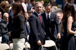 FILE - White House counsel Pat Cipollone, center, arrives for an immigration speech by President Donald Trump in the Rose Garden at the White House, May 16, 2019.