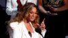 FILE - Beyonce reacts after winning the entertainer of the year award, 50th NAACP Image Awards, Los Angeles, California, March 30, 2019.