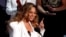FILE - Beyonce reacts after winning the entertainer of the year award, 50th NAACP Image Awards, Los Angeles, California, March 30, 2019. Beyonce is the leading contender in the 2021 Grammys with nine nominations.