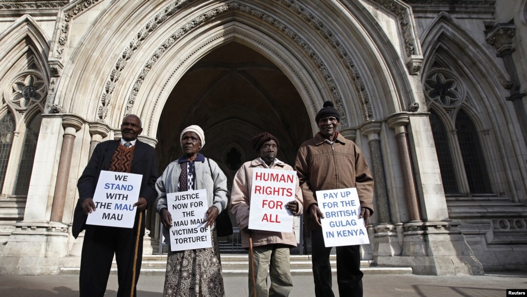 Wambugu Nyingi, Jane Muthoni, Paul Nzili and Ndiku Mutua (L-R) stand outside the High Court in London April 7, 2011. 