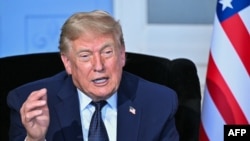 Donald Trump li Hilcivîna G7 de li  Evian, Frensa  Hezîran 15, 2026.