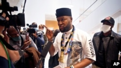 Congolese activist Mwazulu Diyabanza at the Palais de Justice courthouse, in Paris, Sept. 30, 2020, facing charges for trying to remove a 19th century African funeral pole from a Paris museum, in a protest against colonial-era plundering of African art.