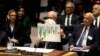 Palestinian President Mahmoud Abbas holds up a document as he speaks during a Security Council meeting at United Nations headquarters.