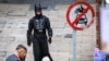 A man dressed as Batman walks on a street in Hong Kong on Jan. 24, 2025.