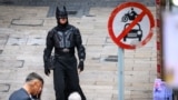 A man dressed as Batman walks on a street in Hong Kong on Jan. 24, 2025.