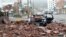 A vehicle damaged by fallen bricks from a building as Typhoon Bolaven brings heavy downpours and winds to Wando, South Korea, August 28, 2012.