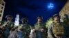 Utah National Guard soldiers stand on a police line as demonstrators gather to protest the death of George Floyd, June 4, 2020, near the White House in Washington. 