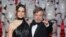 From left, Actors Daisy Ridley (who plays Rey) and Mark Hamill (Luke Skywalker) pose for photographers upon arrival at the premiere of the film 'Star Wars: The Last Jedi' in London, Dec. 12th, 2017.