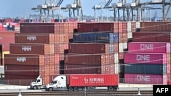 FILE - Shipping containers sit at the Port of Long Beach in Long Beach, California, March 4, 2025. On Thursday, U.S. President Donald Trump on Thursday delayed his new 25% tariffs on most Mexican exports to the U.S. for four weeks.