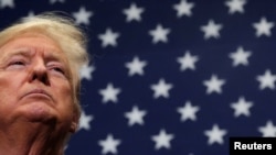 U.S. President Donald Trump reacts during a campaign rally in Charlotte, North Carolina, March 2, 2020.