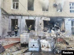 Rescuers enactment    astatine  a tract  of a infirmary  deed  by a Russian drone successful  Sumy, Ukraine, connected  Sept. 28, 2024. (State Emergency Service of Ukraine via Reuters)