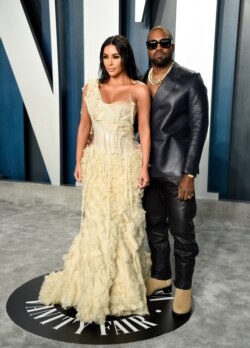 FILE - Kim Kardashian West and Kanye West arrive at the Vanity Fair Oscar Party on Sunday, Feb. 9, 2020, in Beverly Hills, Calif. (Photo by Evan Agostini/Invision/AP)