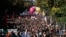 Demonstrators march during a rally to protest President Emmanuel Macron's new pro-business labor policies in Paris, Sept. 21, 2017. 