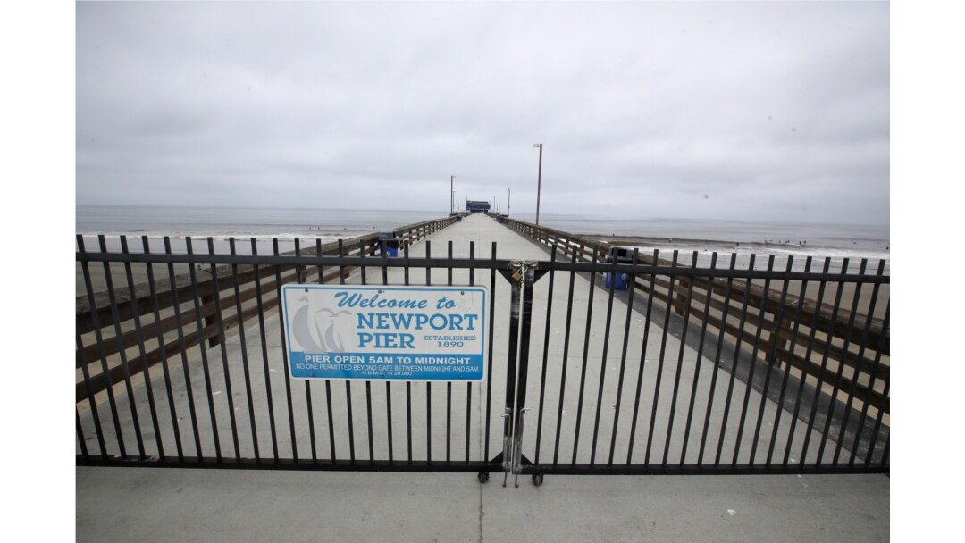 A pier is fenced off in Newport Beach, Calif., April 30, 2020.