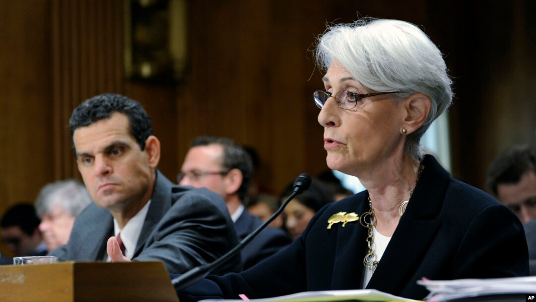 Undersecretary of State for Political Affairs Wendy Sherman (R) accompanied by Treasury Undersecretary For Terrorism And Financial Intelligence David Cohen, testifies on Capitol Hill in Washington, July 29, 2014.