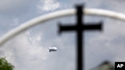 FILE - A surveillance balloon is used near the Texas-Mexico border, in Los Ebanos, Texas, Sept. 16, 2015.