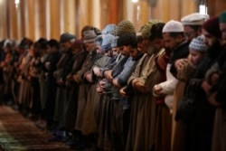 FILE - Kashmiri Muslims offer prayer inside Jamia Masjid in Srinagar, Indian controlled Kashmir, Dec. 18, 2019.