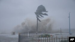 FILE - Waves hit the Bay of Bengal coast as Cyclone Yaas intensifies in West Bengal state, India, May 26, 2021. India is bracing for a powerful cyclone that is likely to hit portions of the western state of Gujarat on Thursday.