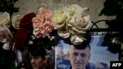 FILE —This photograph taken in Paris on March 1, 2024, on the day of his funeral in Moscow, shows flowers left as a tribute to Russian opposition leader Alexei Navalny.