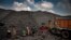 Indian laborers load coal into a truck in Dhanbad, an eastern Indian city in Jharkhand state, Friday, Sept. 24, 2021. (AP Photo/Altaf Qadri)