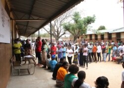 Voters queue to cast their votes in Maputo, Mozambique, Oct. 15, 2019.