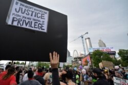 Demonstrators protest, June 5, 2020, in Atlanta. Protests continued following the death of George Floyd, who died after being restrained by Minneapolis police officers on May 25.