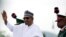 FILE - Nigerian President Muhammadu Buhari waves to the crowd while he drives around the venue during his inauguration for a second term in Abuja, Nigeria, May 29, 2019.