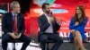 Liberty University president, Jerry Falwell Jr., and Kimberly Guilfoyle, listen as Donald Trump Jr. speaks at a Liberty University Convocation, Nov. 13, 2019, in Lynchburg, Va. 