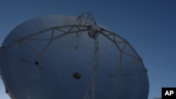 A view from the center of the ALMA array at an elevation of 5,000 meters on the Chajnantor Plain in northern Chile. Each of these radio telescopes has a dish spanning nearly 40 feet across.