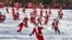 FILE - Skiers and snowboarders dressed as Santa take a run en masse at Sunday River ski resort, Dec. 6, 2015, in Newry, Maine.